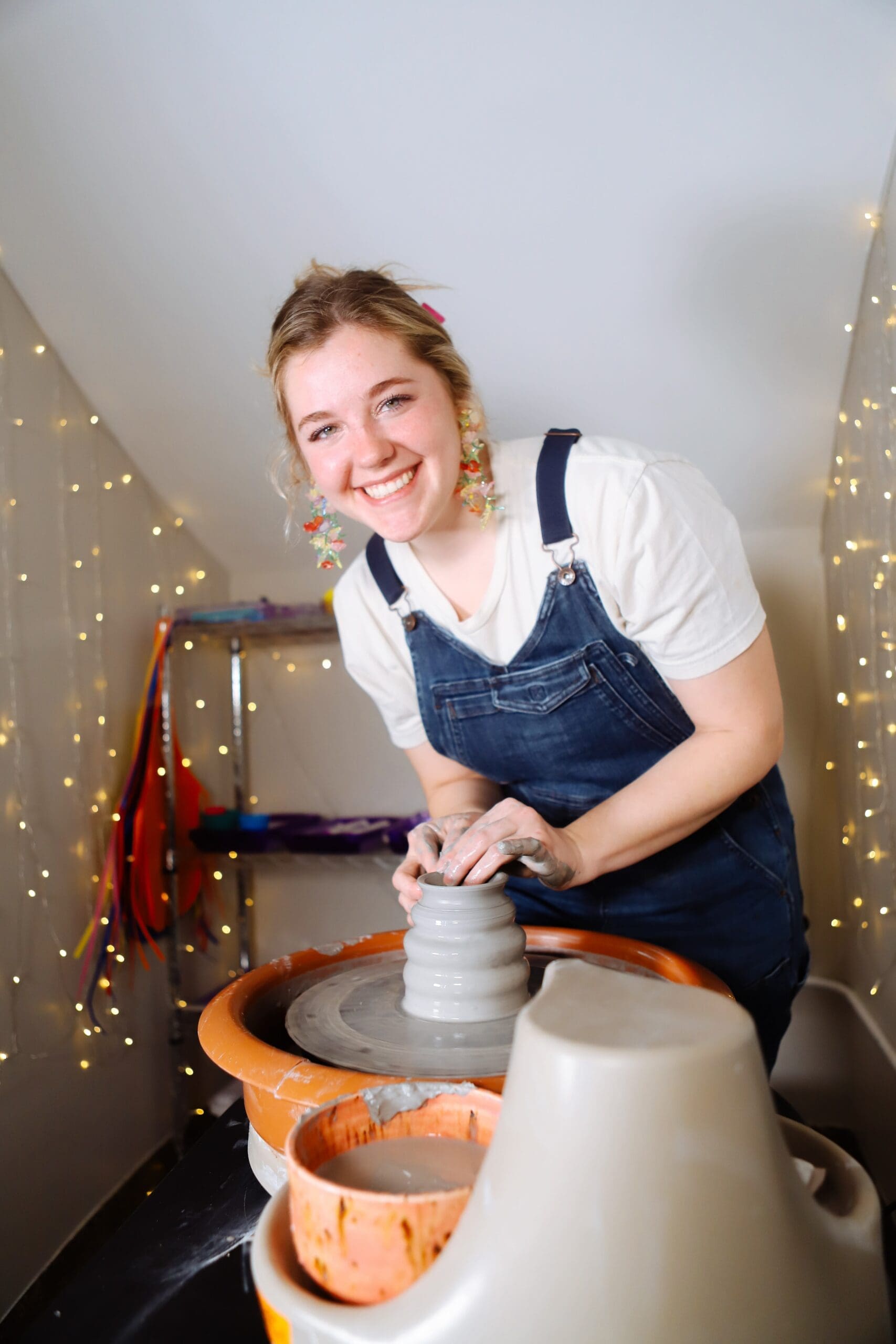 Gabrielle King works on a pottery piece.