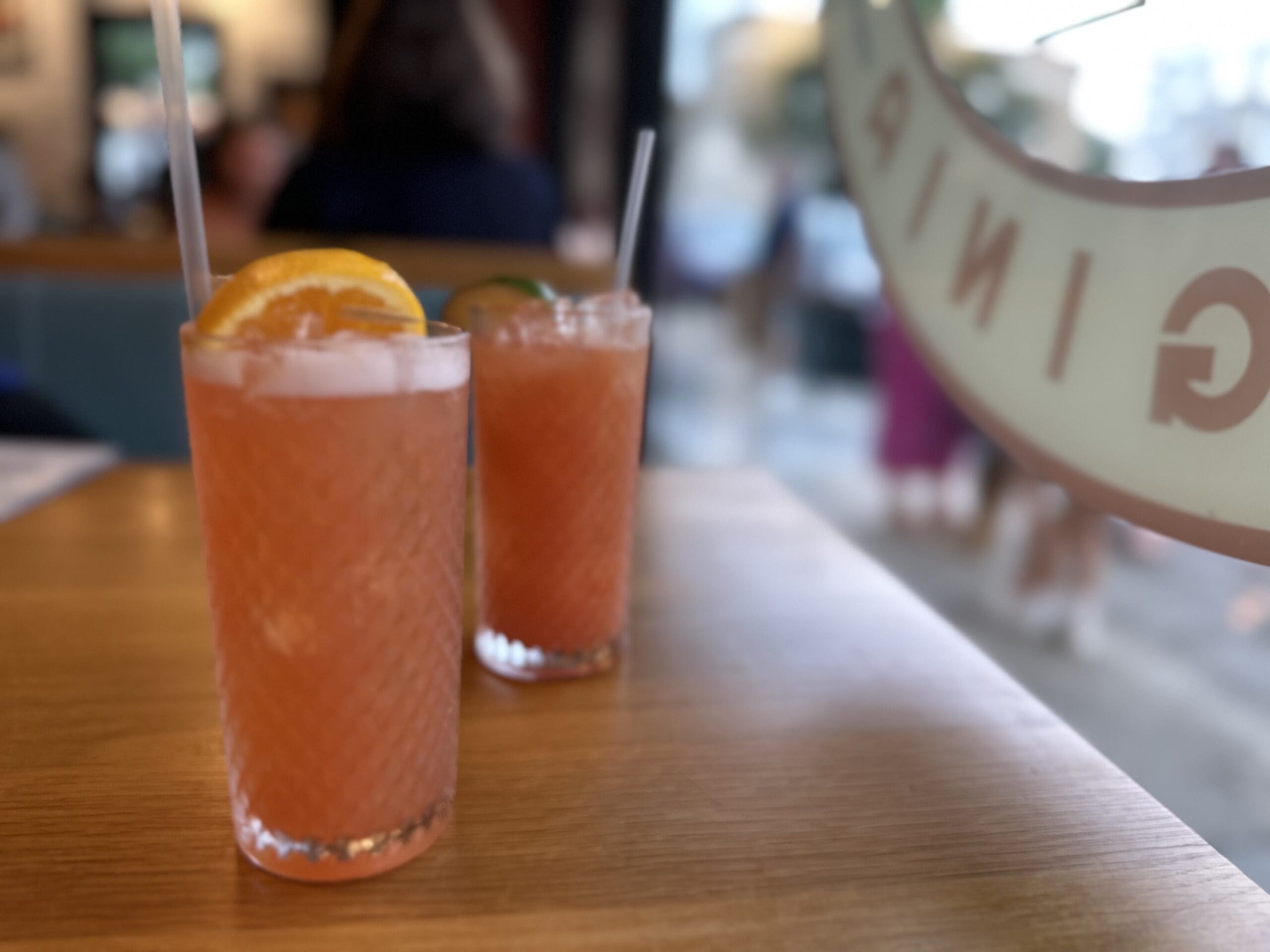 The menu includes custom cocktails.