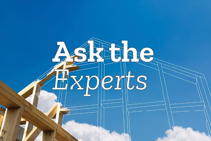 Wood framing of a house under construction against a blue sky, overlaid with the words "Ask the Experts.